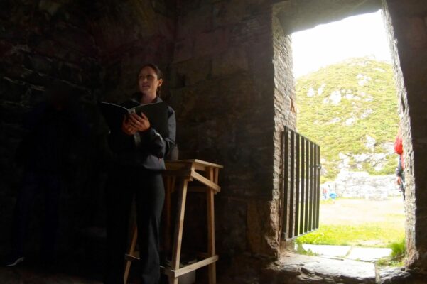 Guide from FjordGuiding singing in the monastery.