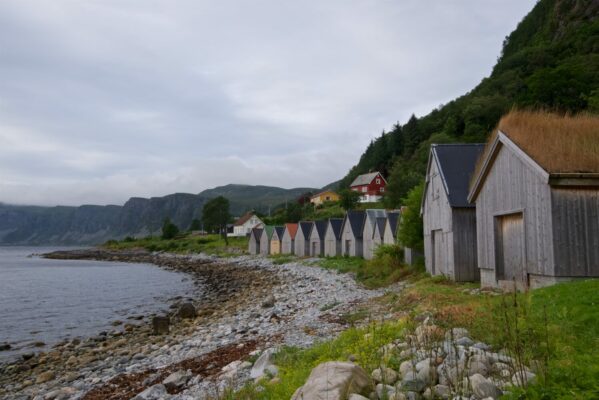 The boathouses between Seljesanden Beach and Selje Church.